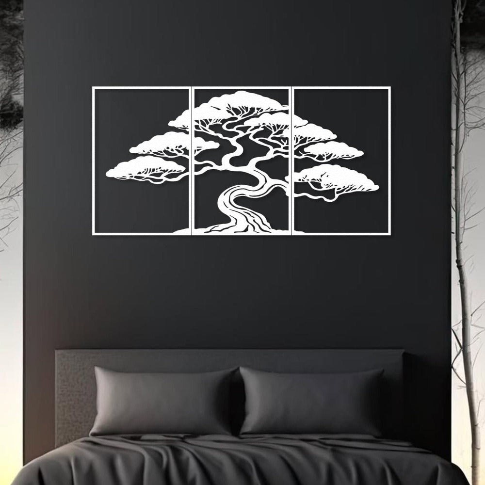 Three-piece white metal wall art featuring a bonsai tree with intricate details, mounted on a dark black wall. The artwork is placed above a modern bed with black bedding, creating a bold and minimalist bedroom aesthetic.