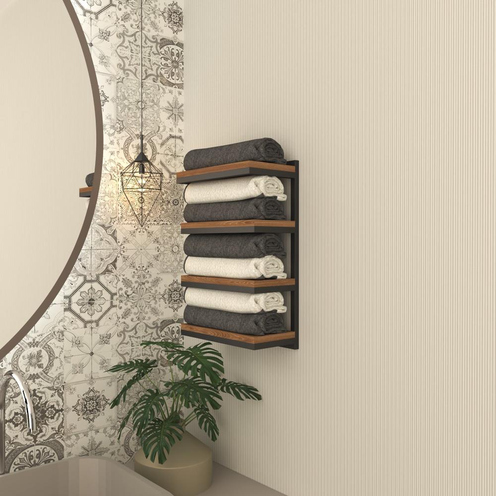 A 4-tier towel stacker with a sleek black metal frame and wooden shelves, neatly holding rolled gray and white towels in a stylish bathroom with patterned tiles.