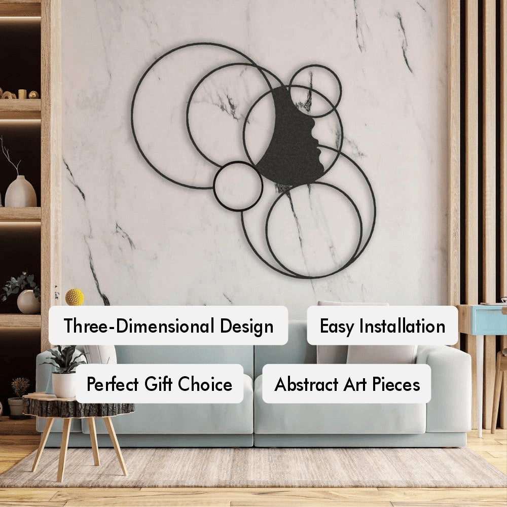 Modern abstract metal wall art featuring overlapping circles and a face silhouette, creating a three-dimensional design perfect for adding artistic depth to any room.