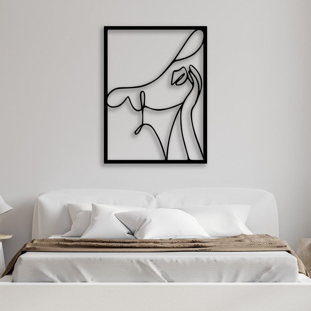 Abstract woman with a hat black metal wall art displayed above a neutral-toned bed, enhancing the cozy bedroom ambiance.