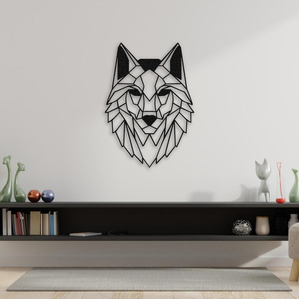Geometric wolf head metal wall art in black, mounted on a white wall above a modern dark shelf with books and decorative items. Minimalist decor complements the design, creating a contemporary living room setting.