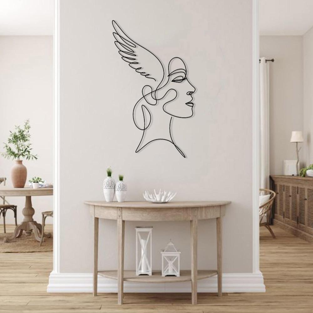 A bright hallway with a neutral-tone console table decorated with vases and candles, featuring angelic winged woman wall art as a focal piece.