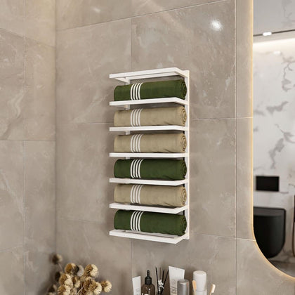Modern bathroom featuring a white wall-mounted towel rack that holds neatly rolled green and beige towels. The towel rack is fixed on sleek, light grey tiles, adding a clean and organized look to the bathroom decor.