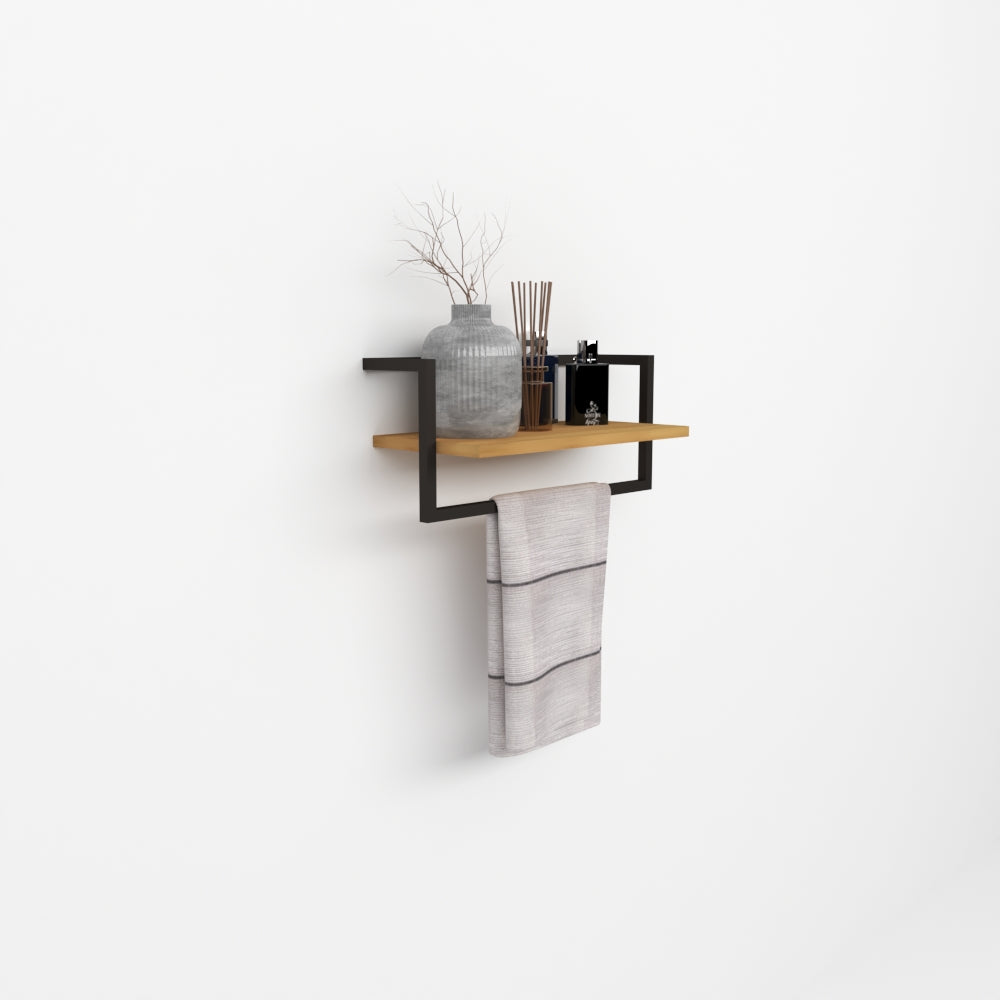 A minimalist black metal bathroom shelf with a natural wood finish, mounted on a white wall, holding a vase, reed diffusers, and a hanging towel.