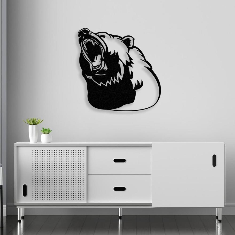 Black metal bear silhouette wall art featuring a roaring bear head, mounted above a modern white console cabinet with minimalist decor, including small green plants in white pots.