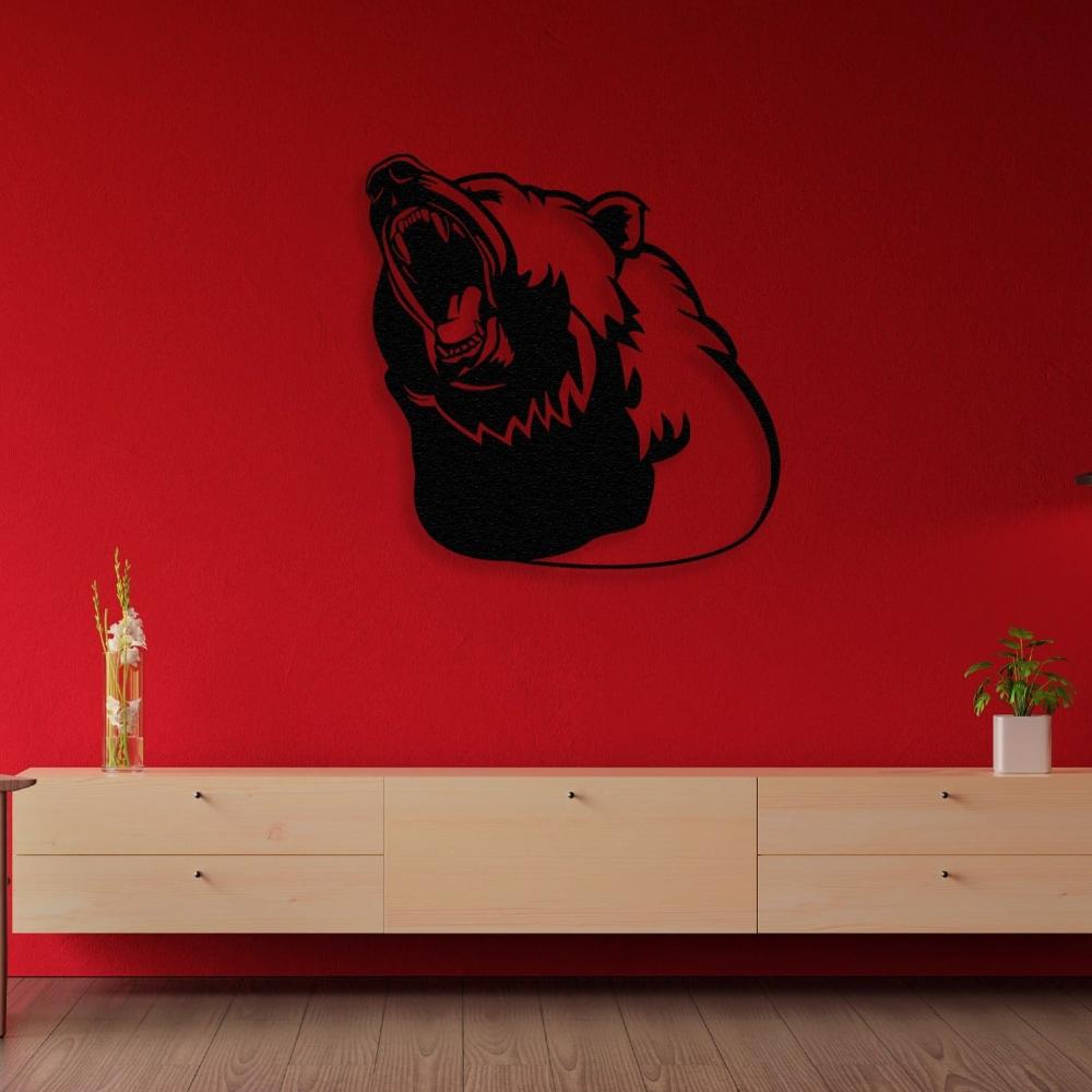 Black metal bear silhouette wall art featuring a roaring bear head, mounted on a vibrant red wall above a light wooden console, accented with minimalist decor including a tall vase with flowers and a small green plant.