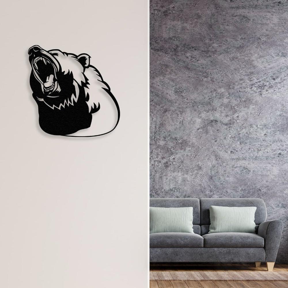 Black metal bear silhouette wall art featuring a roaring bear head, mounted on a beige wall adjacent to a modern grey textured wall, complemented by a grey sofa with light green cushions.