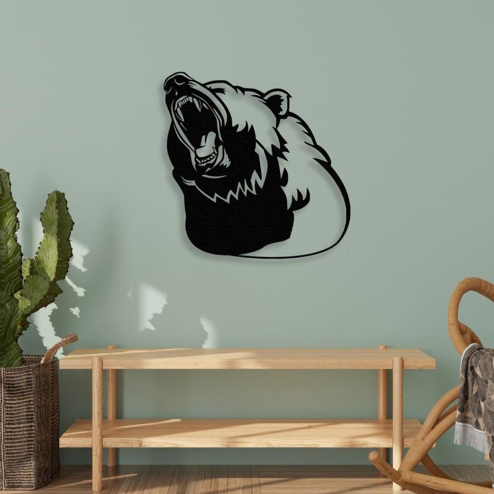 Black metal wall art of a roaring bear silhouette mounted on a light green wall above a wooden bench, complemented by a wicker basket with a plant and cozy decor.
