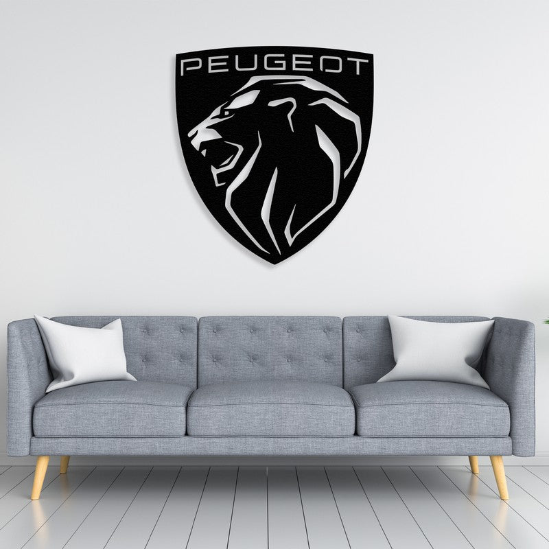 Modern peugeot logo black metal car logo wall art above a sleek gray sofa in a contemporary living room, complemented by minimalist decor and indoor greenery.
