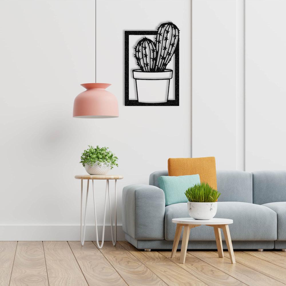 A modern living room featuring a pastel blue sofa, bright orange cushions, and a black "Cactus in Vase" metal wall art on a white wall, with vibrant indoor plants as accents.