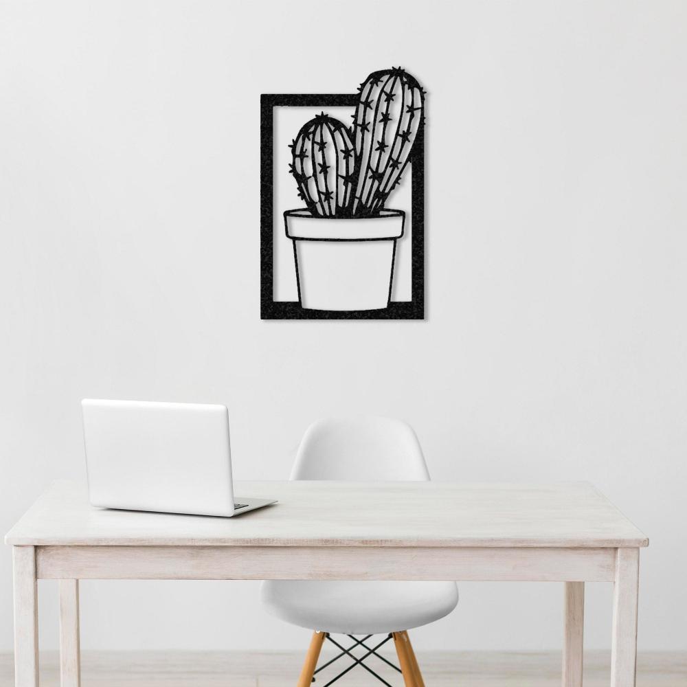A contemporary corner setup with a light blue armchair, a small wooden side table with a floral bouquet, and a black "Cactus in Vase" metal wall art on a gray textured wall.