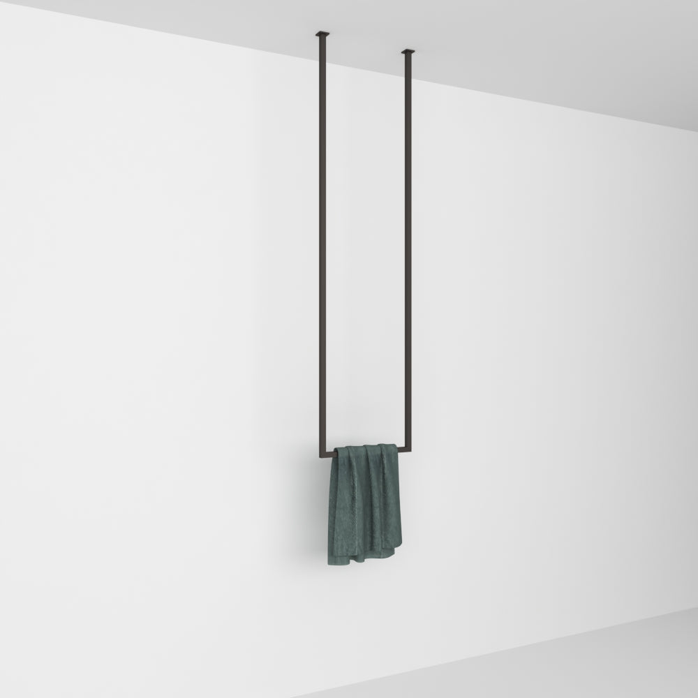 Ceiling-mounted towel rack shown in a plain white setting, highlighting its simplicity and functionality with a green towel.