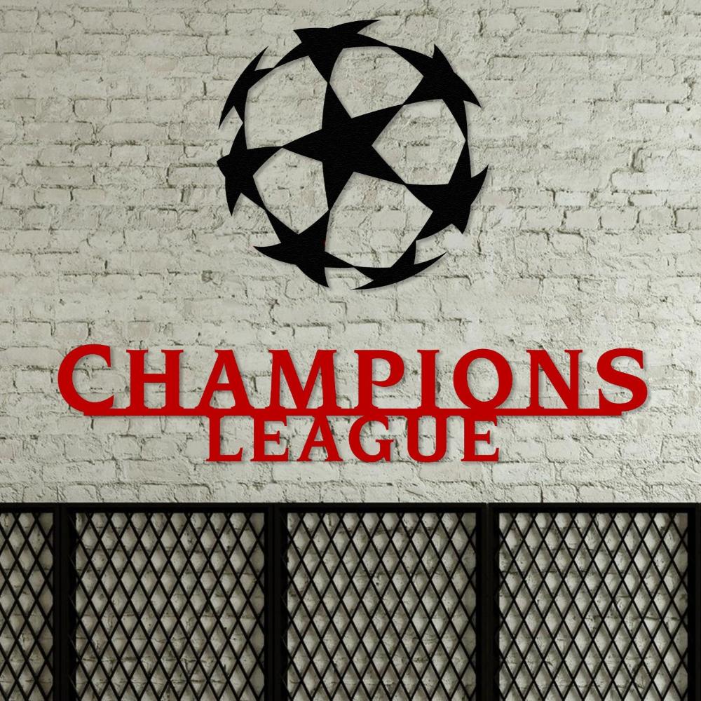 Black and red Champions League wall art with a prominent star-patterned ball design, mounted on a white brick wall above a decorative metal panel.