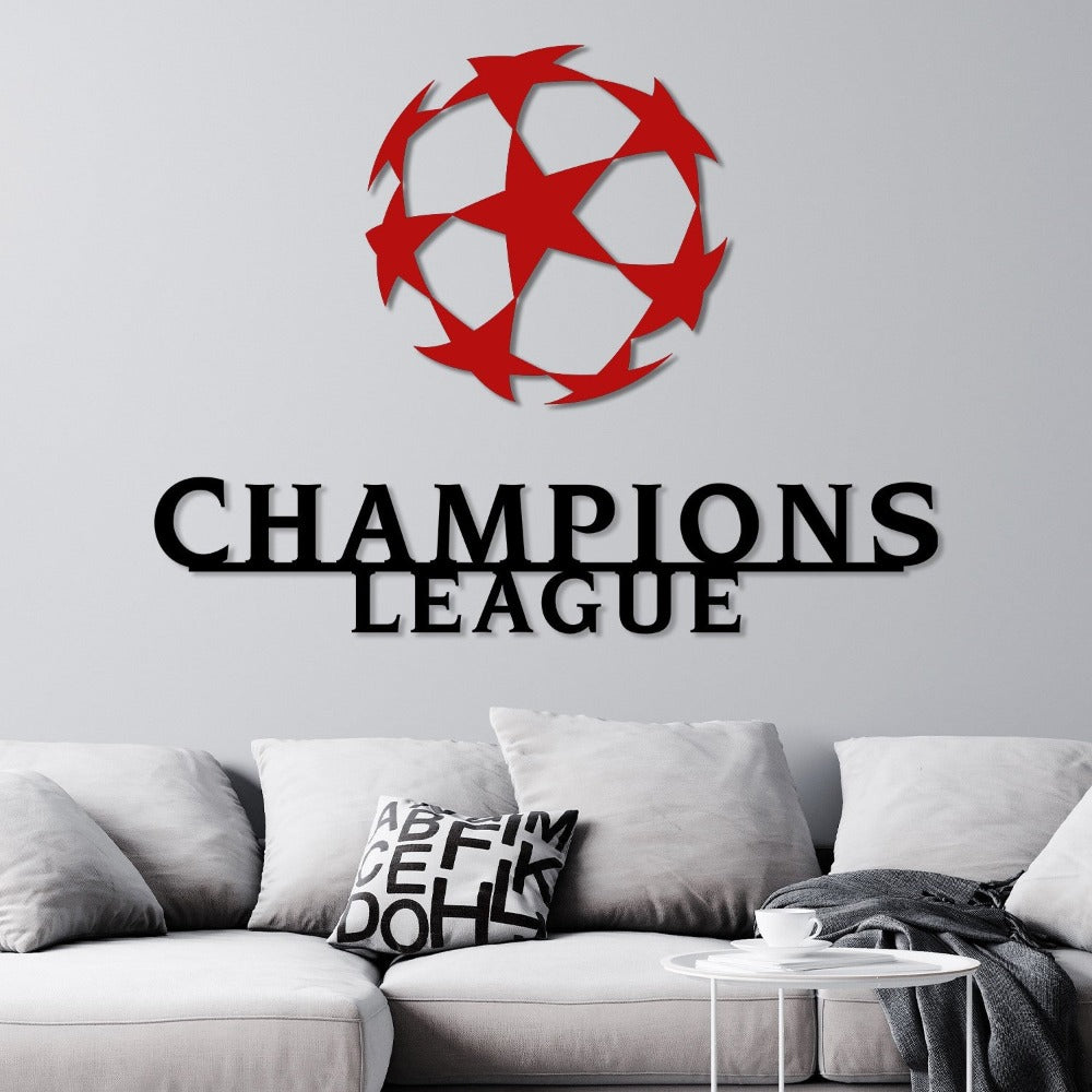 Modern Champions League wall art in black and red, featuring a striking star-patterned ball and bold text, mounted above a neutral-toned sofa.