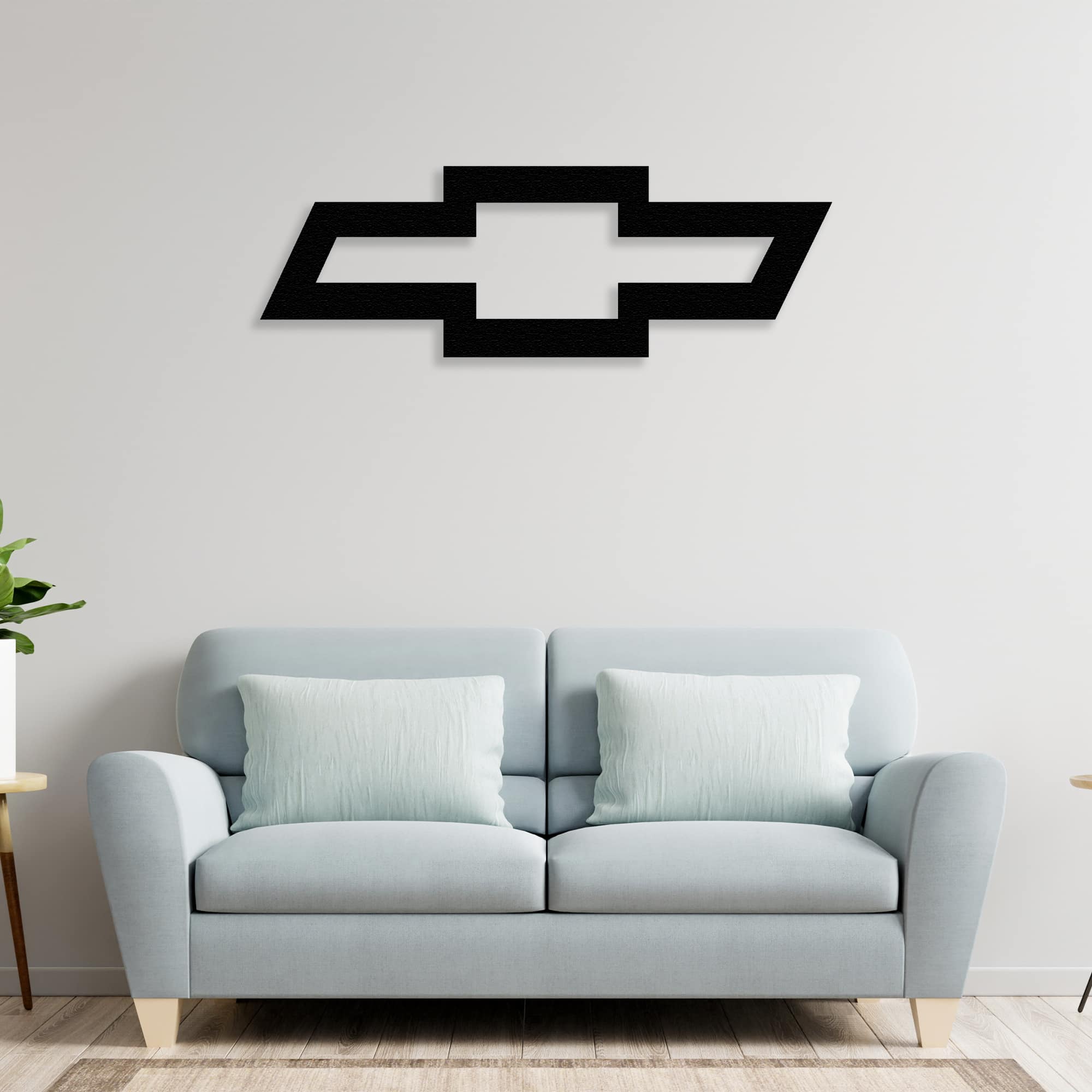 chevrolet metal wall art decor on the sofa