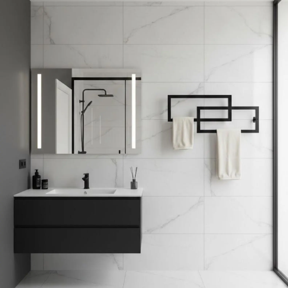 Modern bathroom with black vanity, mirror, and towel rack.