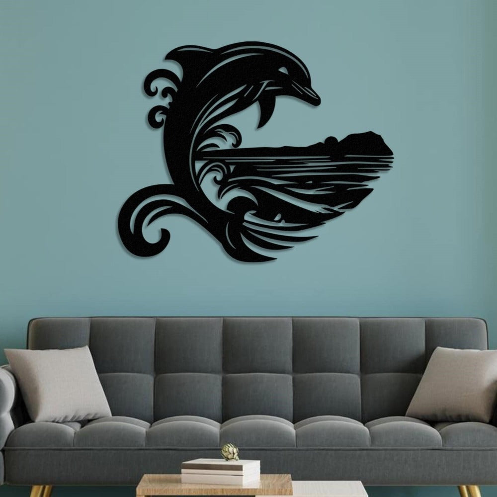 Black metal wall art featuring a stylized dolphin jumping over ocean waves with a scenic island silhouette, mounted on a teal wall above a modern gray sofa with beige pillows and a wooden coffee table.
