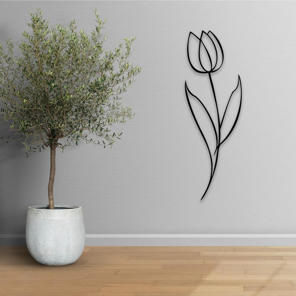 Minimalist black metal tulip wall art decor mounted on a gray wall next to a potted olive tree, placed on a wooden floor, creating a serene and modern interior.