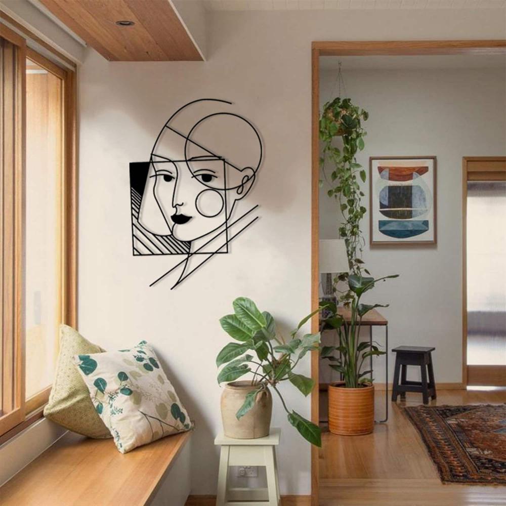 A geometric lady wall art showcased in a bright and airy interior, surrounded by greenery and contemporary decor.