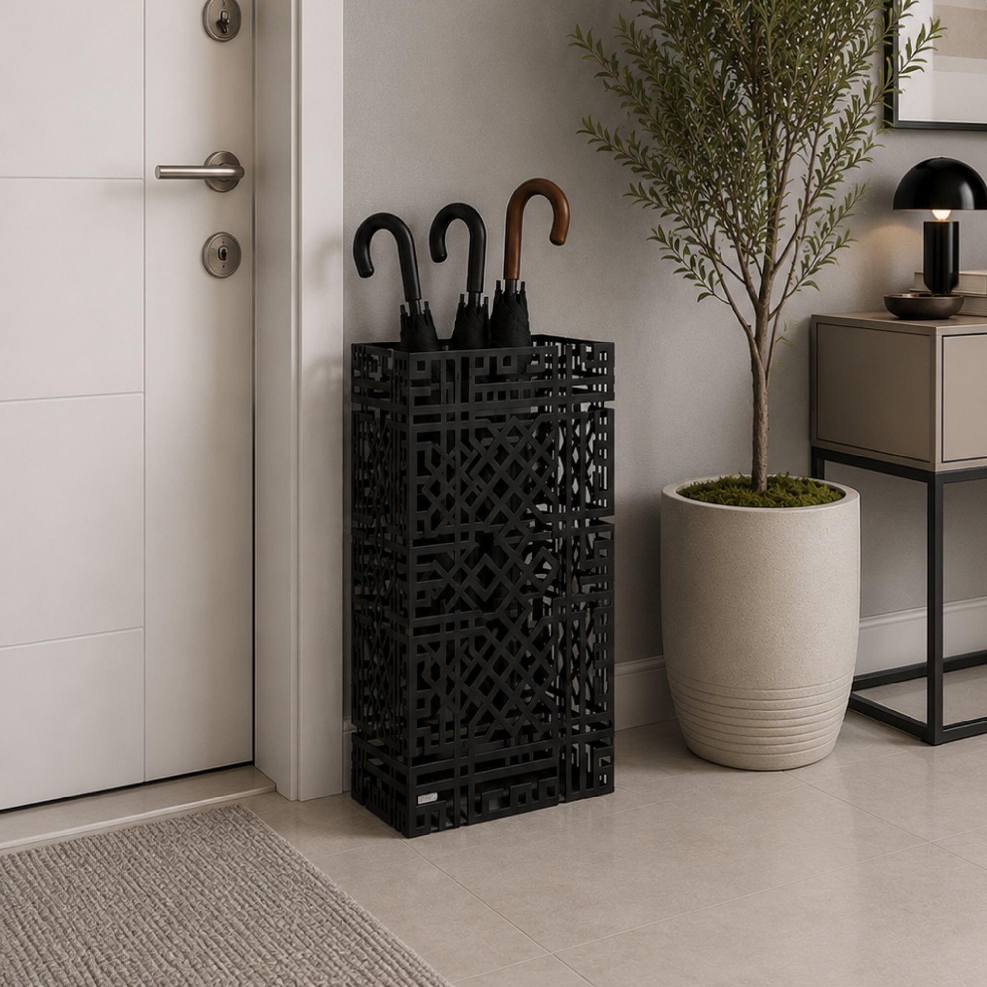 Black geometric lattice metal umbrella stand beside shoe storage bench in modern hallway