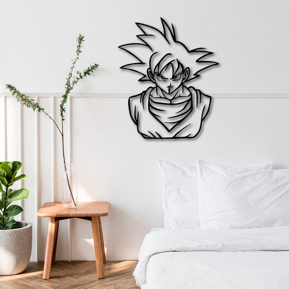 Black metal wall art of a stylized character with spiky hair and a serious expression, mounted on a white wall above a white bed. A wooden side table with a glass vase and a green plant in a pot is placed on the left.