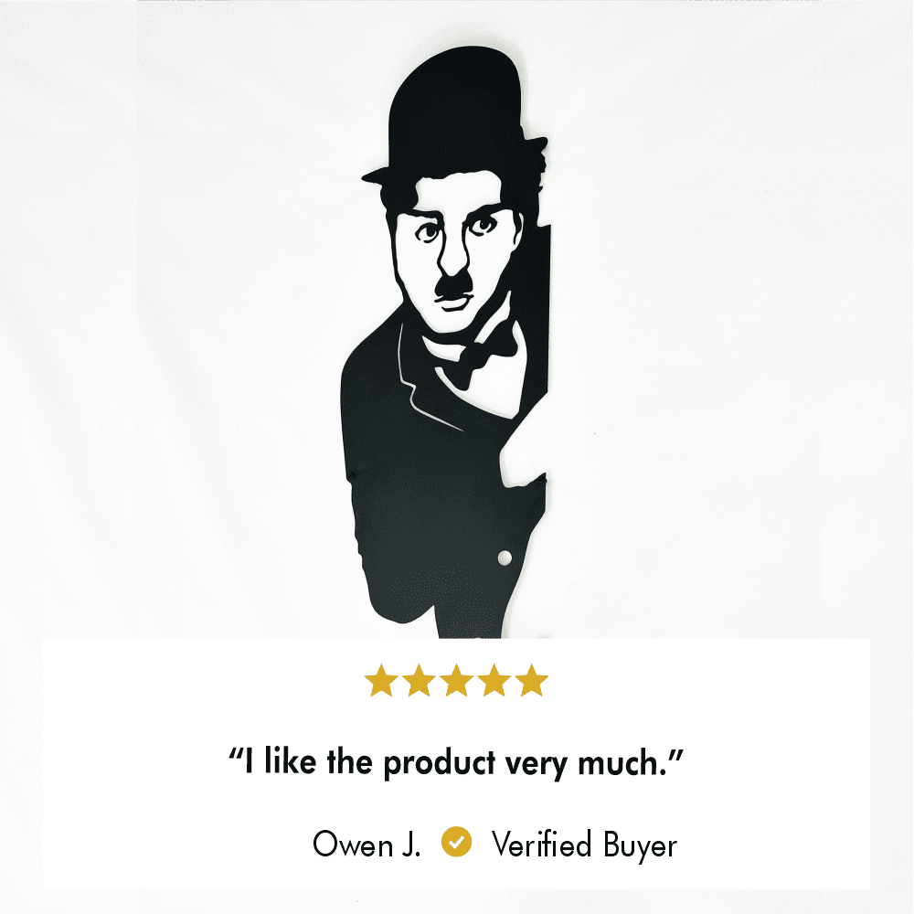 Black Charlie Chaplin metal wall art showcased on a plain white background, featuring a verified buyer review that reads, "I like the product very much." Five-star rating included, with the name Owen J. highlighted as the reviewer.