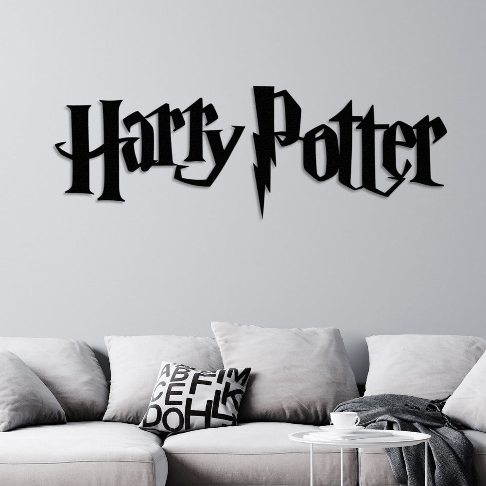 "Harry Potter" black metal wall art featuring a lightning bolt design, mounted on a light gray wall above a modern sofa with gray cushions and a black-and-white patterned pillow, accompanied by a small white side table.