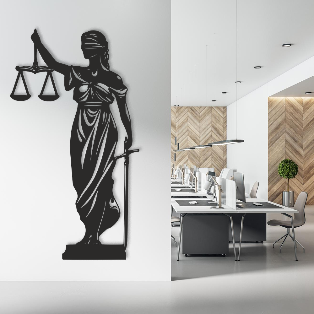 Decorative wall sculpture of a blindfolded figure holding scales on a white background, next to an office setting with desks and chairs.