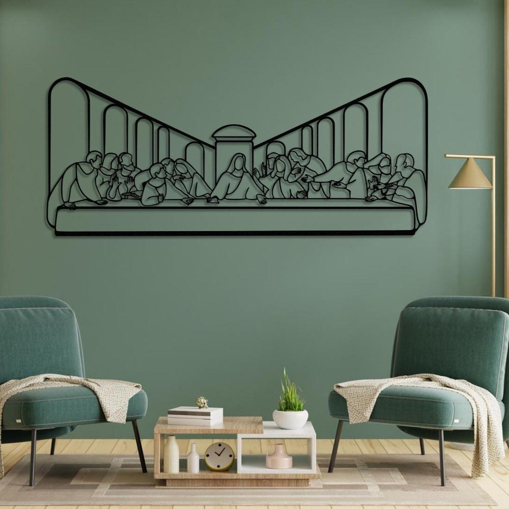laBlack metal wall art of "The Last Supper" displayed on a green wall, accompanied by two stylish green armchairs and a wooden coffee table adorned with decorative items.