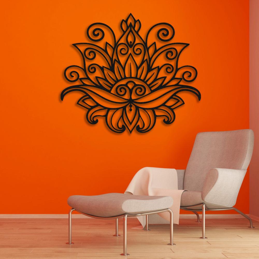 Mandala lotus metal wall art with intricate floral and swirl patterns mounted on a vibrant orange wall, enhancing a modern seating area with a minimalist chair and ottoman.