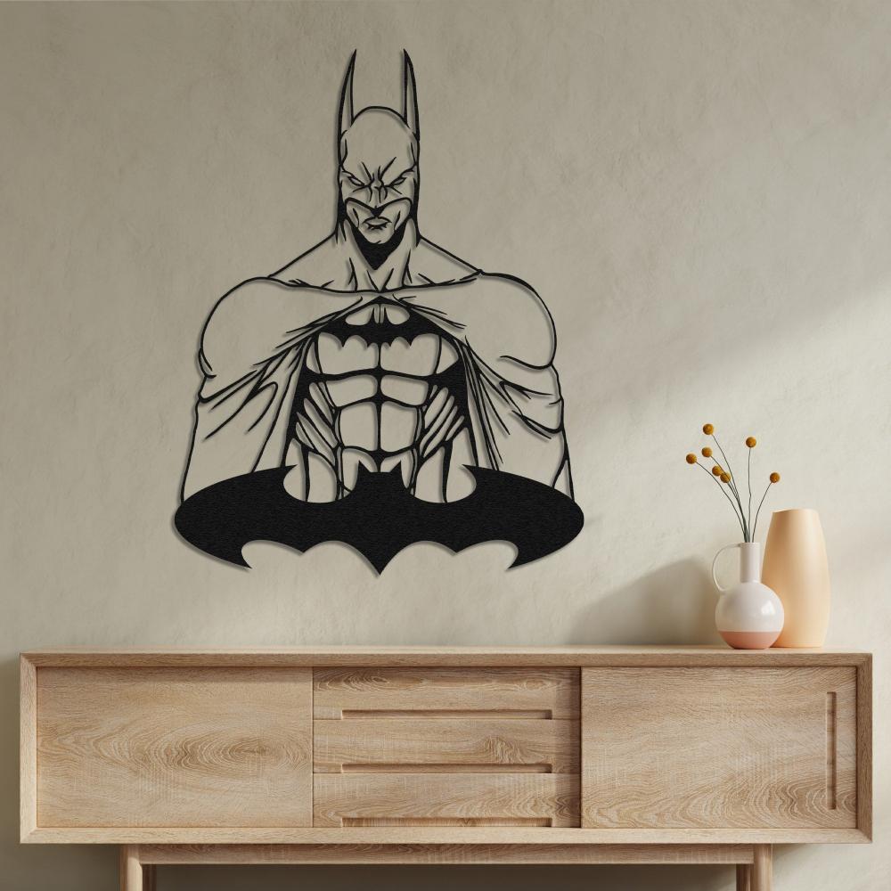Batman metal wall art mounted on a neutral wall above a minimalist wooden console table, styled with a ceramic vase holding decorative branches and a modern pitcher.