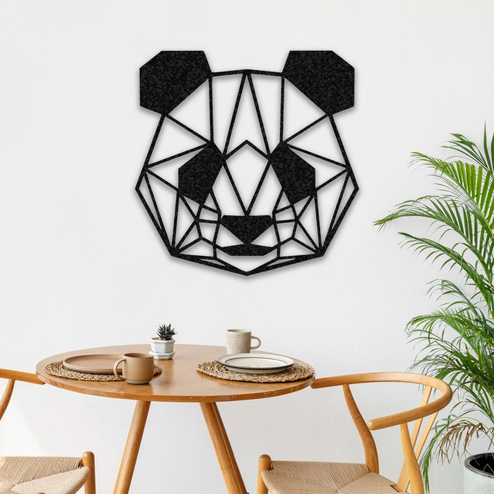 Black geometric panda wall art hanging on a white wall above a round wooden dining table set with minimalist tableware and surrounded by light wooden chairs, with a leafy plant adding a fresh touch to the decor.