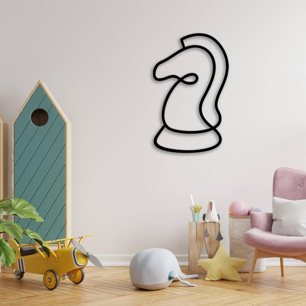 Black chess knight metal wall art placed in a modern kids' playroom, featuring a toy airplane, plush whale, and pastel furniture.