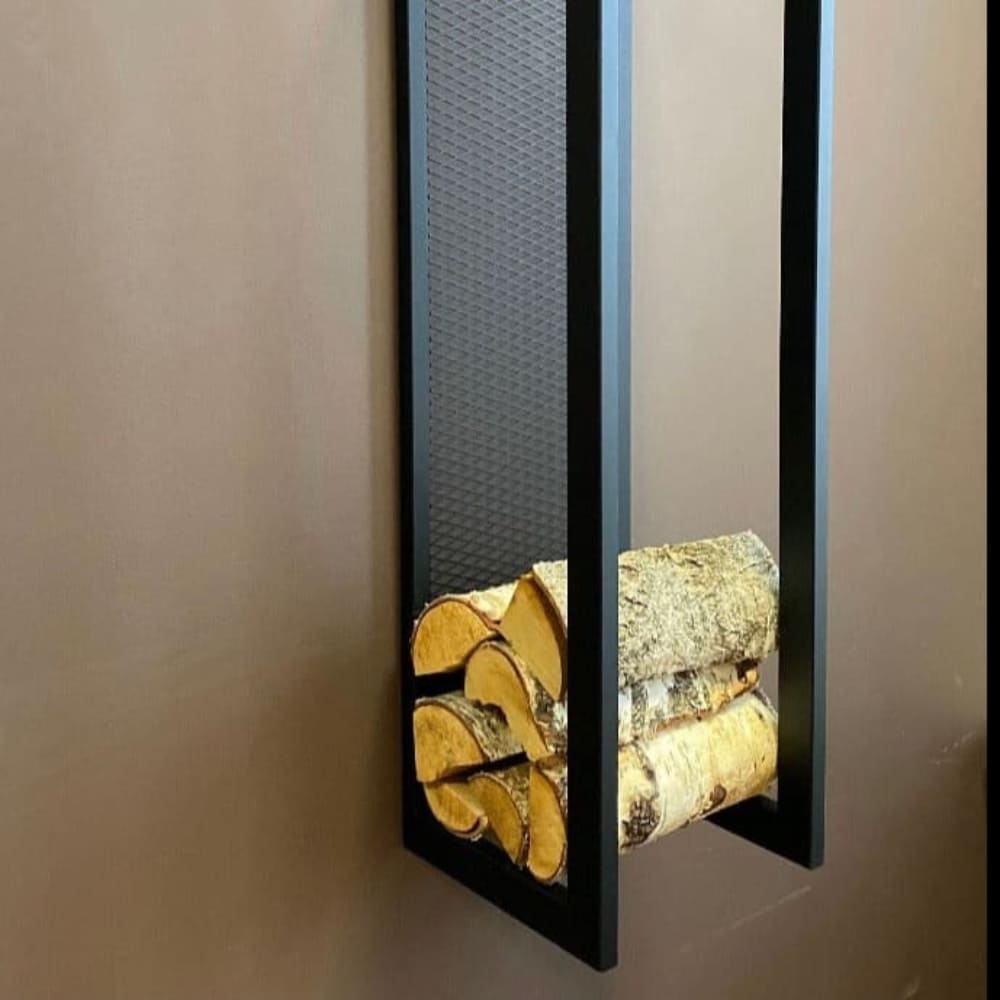 Close-up view of a black metal wall-mounted firewood holder against a brown wall, showcasing stacked firewood logs neatly arranged in the lower section