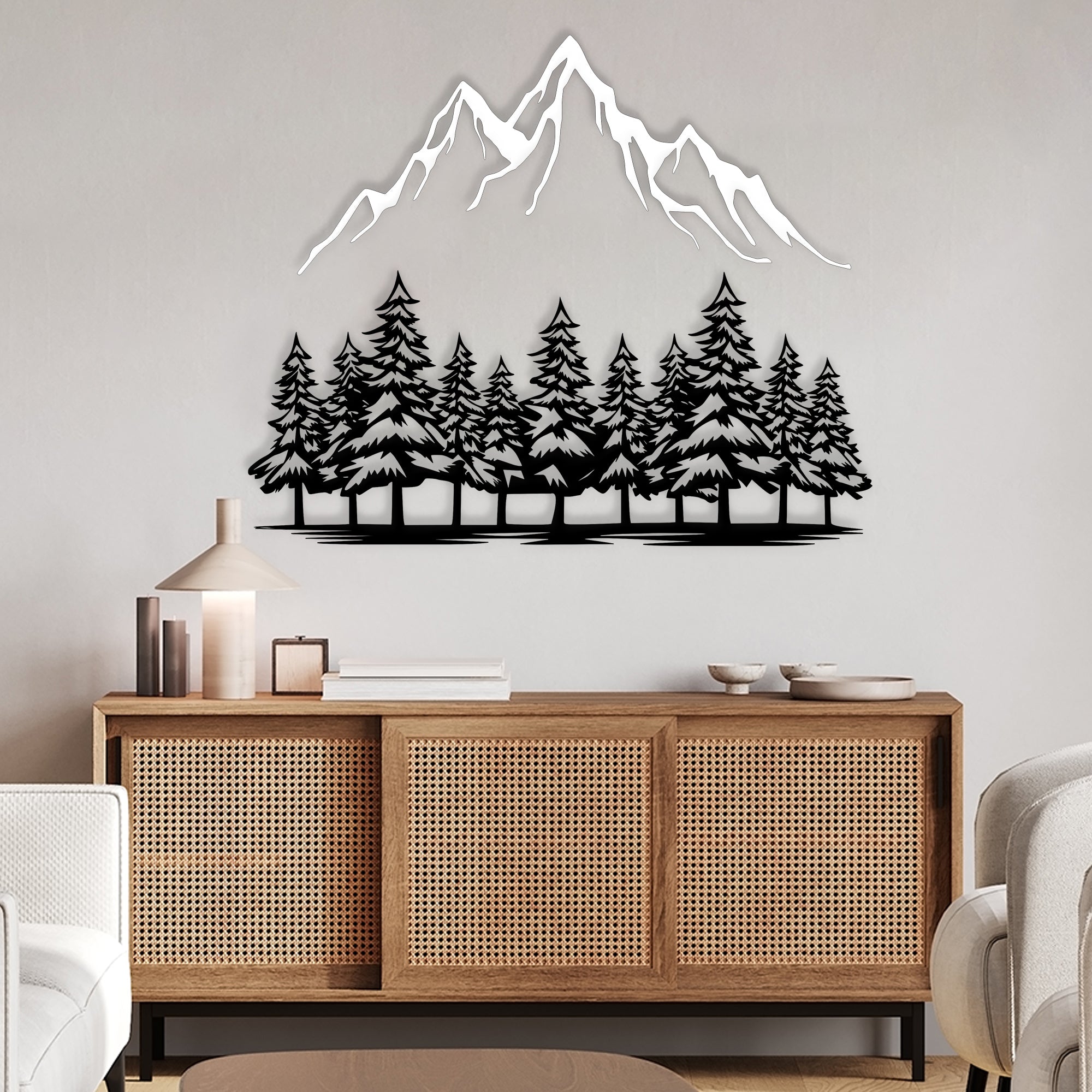 Nature-inspired metal wall art featuring trees and mountains.