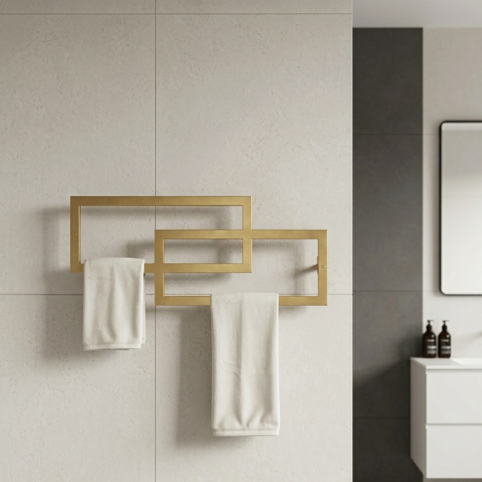 Gold towel rack with white towels in a bathroom setting