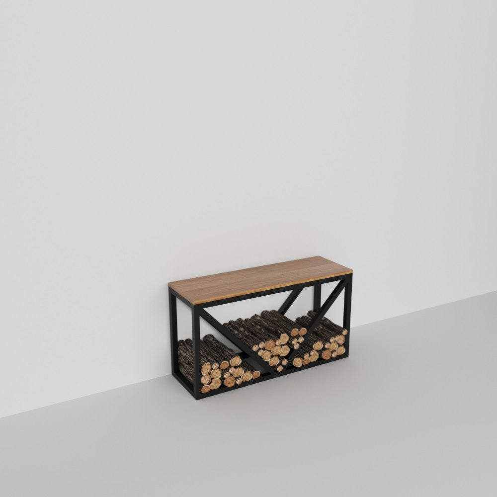 A simple and minimalist metal log holder with a wooden bench in a white space. Logs are neatly arranged under the bench, showcasing its practical design.