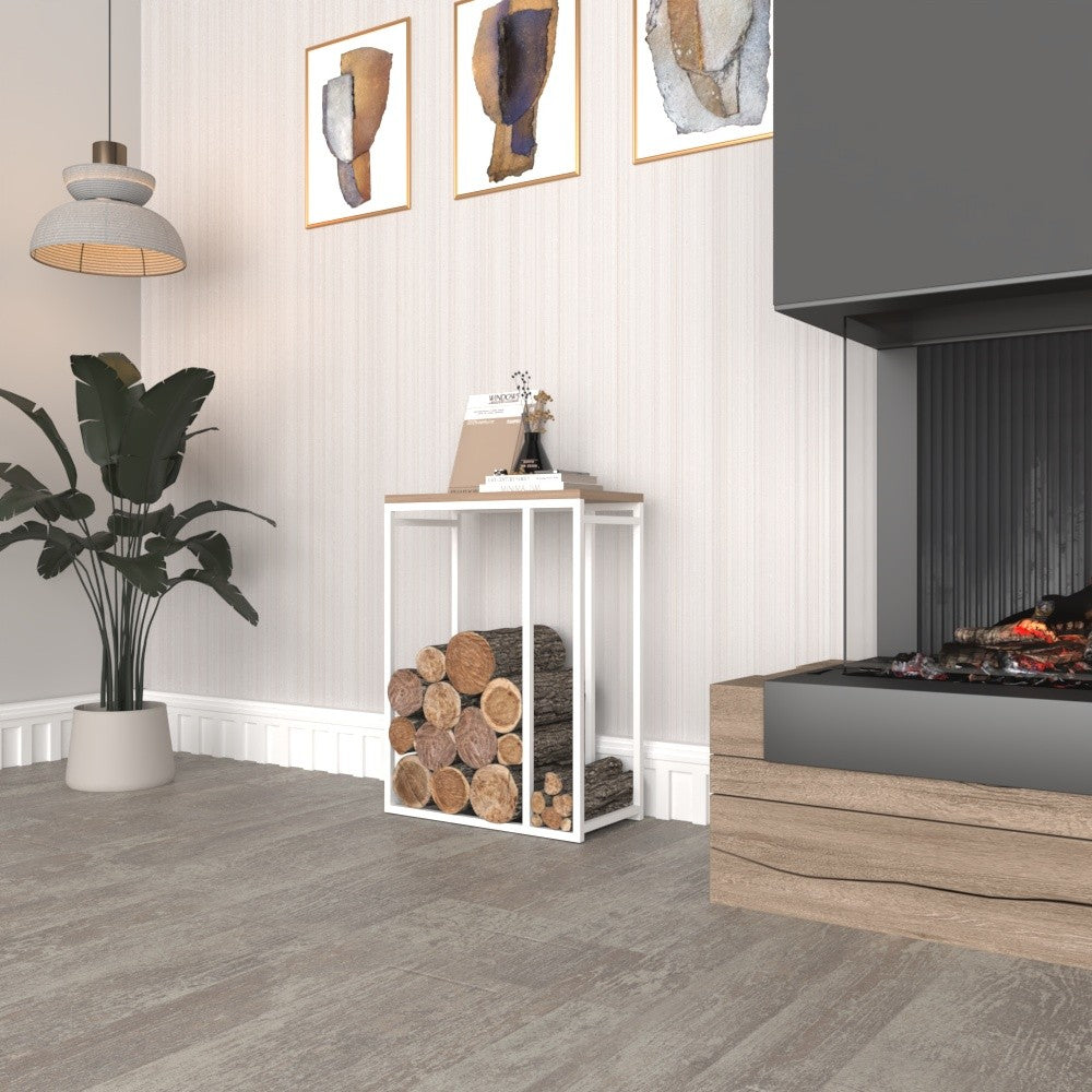 A minimalist metal log rack with a white frame and wooden top, placed beside a modern fireplace and decorated with a plant and books