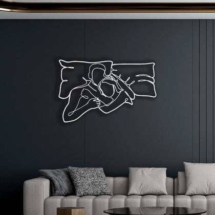 White Romantic Lying Couple Line Art Metal Wall Art in a living room