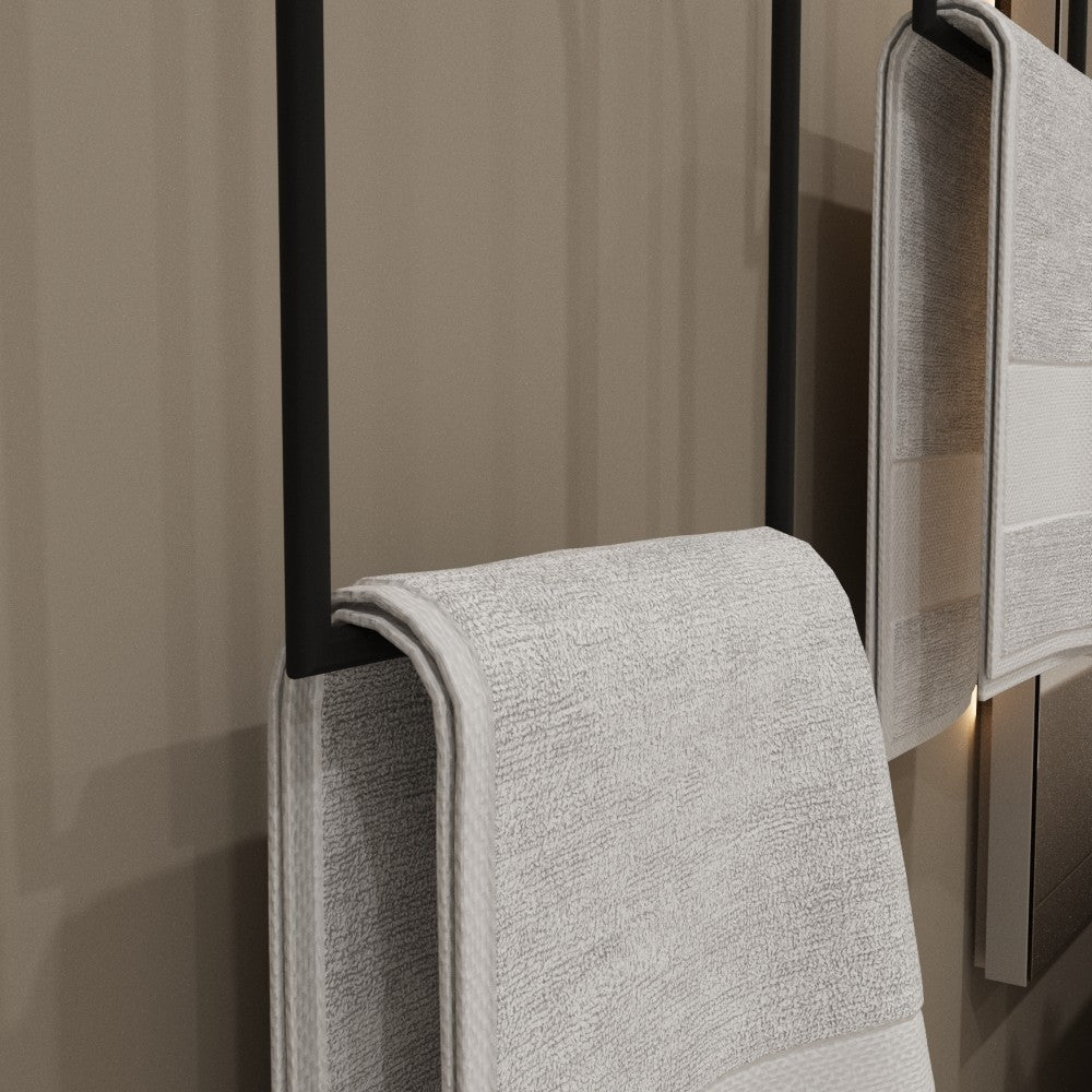 A minimalist towel ring securely holding a white towel, emphasizing its functional and aesthetic appeal in a contemporary setting.