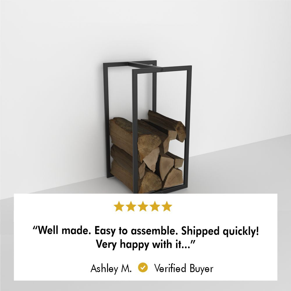 Minimalist wall-mounted firewood holder with a sleek black frame, filled with neatly stacked logs against a plain white background. Featured with a 5-star review: "Well made. Easy to assemble. Shipped quickly! Very happy with it..." – Ashley M., Verified Buyer.