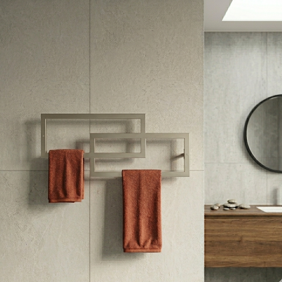Bathroom with a towel rack holding two red towels against a tiled wall.