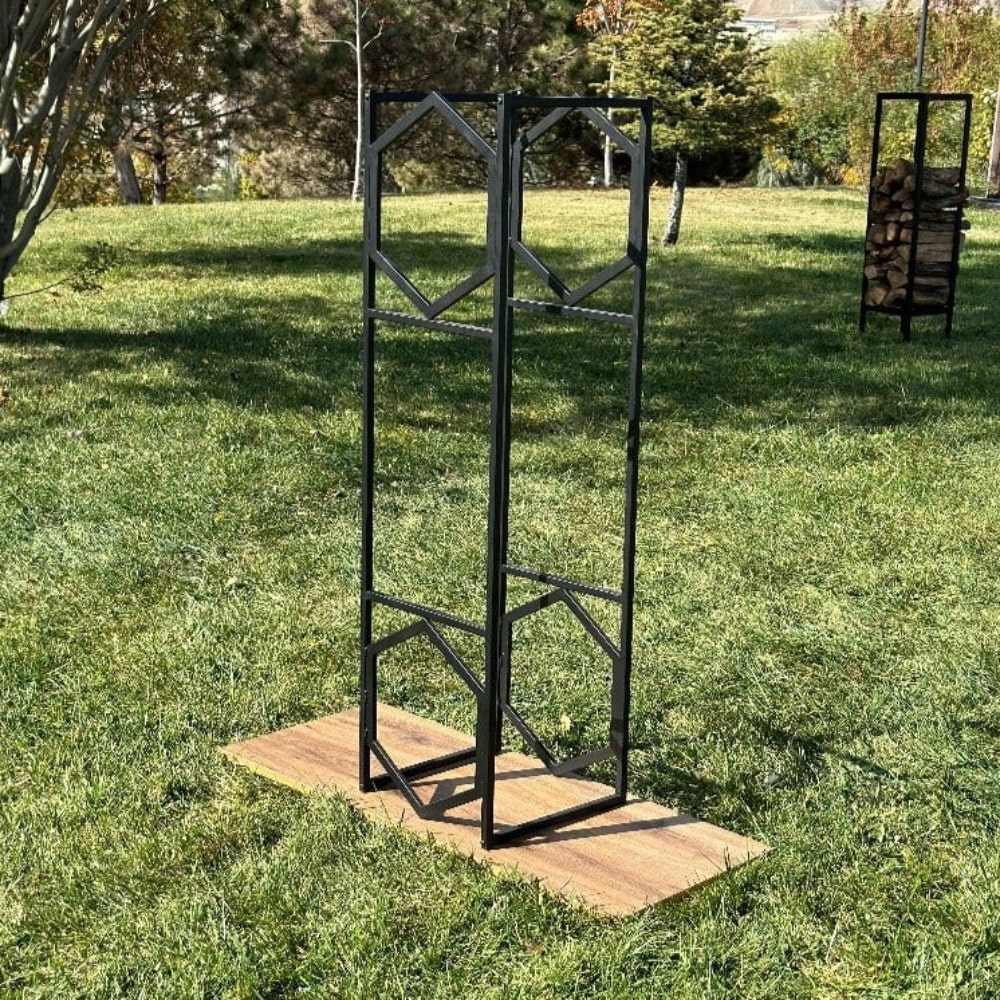 Empty black hexagonal metal log holder displayed outdoors, highlighting its geometric design and sturdy structure.