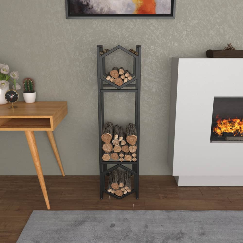 A modern black metal log holder with a hexagonal design, displayed in a cozy indoor setting near a fireplace, featuring neatly arranged logs on three tiers