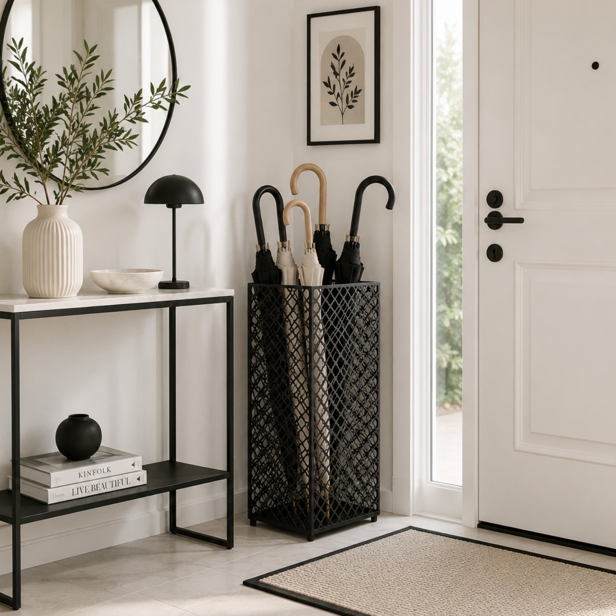 Black mesh metal umbrella stand in bright entryway with mirror and minimalist Scandinavian decor