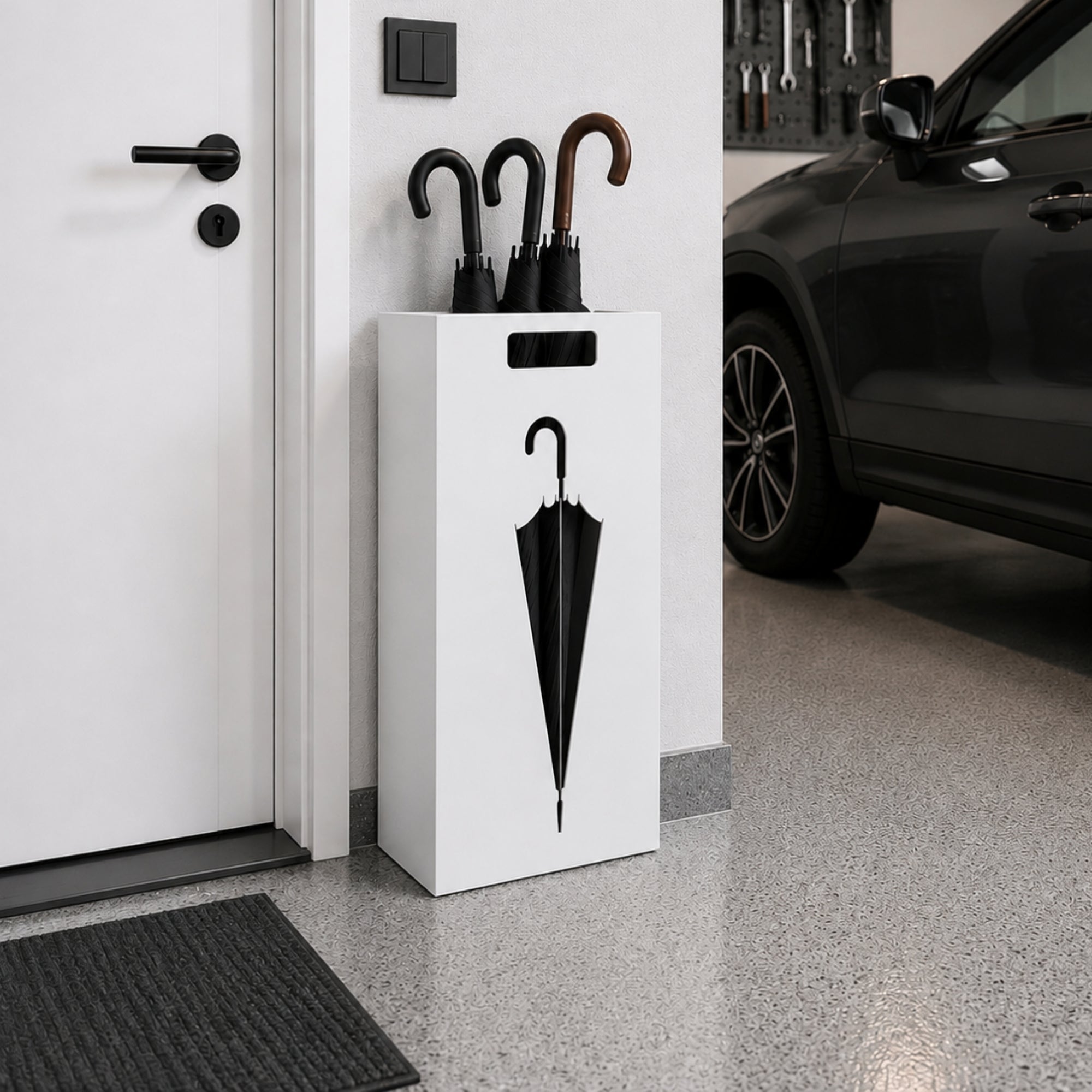 Modern white metal umbrella stand with umbrella silhouette cutout in contemporary garage entryway