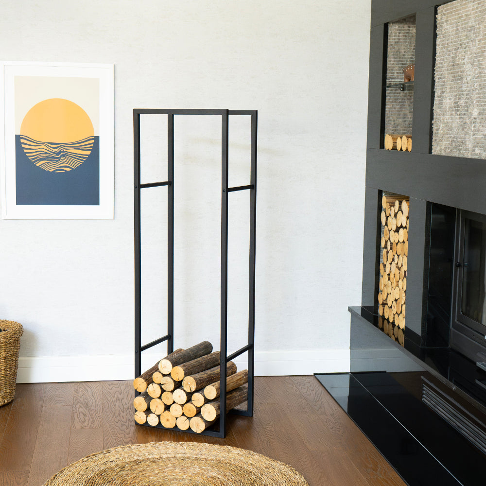 Modern living room with a black metal firewood rack, fireplace, and wall art. modern log holder for fireplace, minimalist firewood rack with shelf