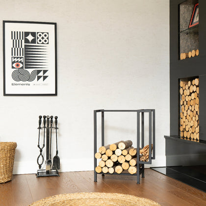 Modern living room with a fireplace and the Modern Metal Firewood And Kindling Storage holding firewood and kindling