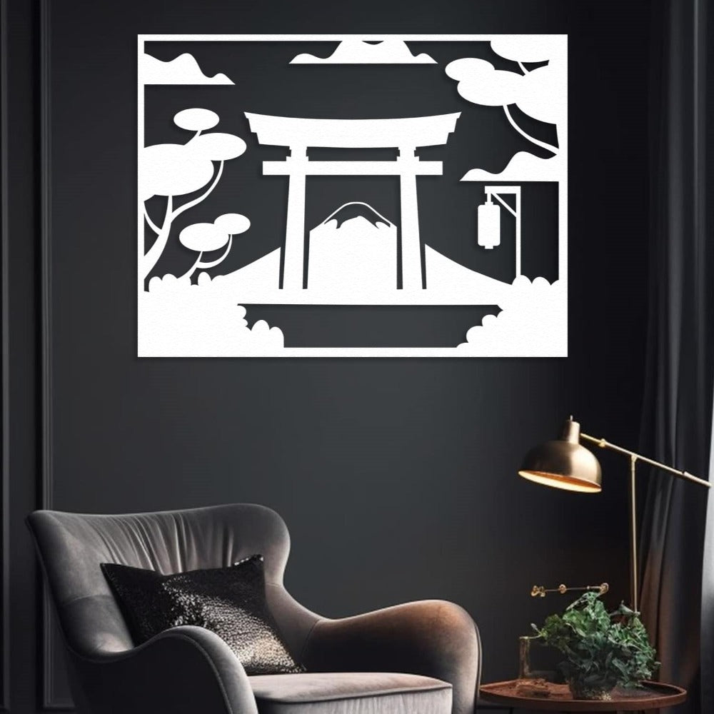 A white metal wall art featuring a Japanese Torii gate and Mount Fuji, elegantly displayed in a dark modern living room with a cozy armchair and a lamp.