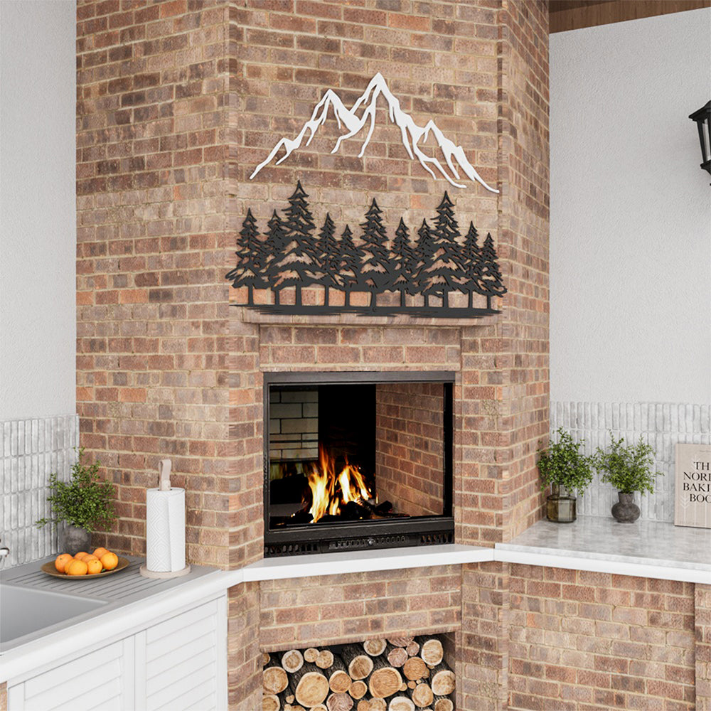 Metal wall decor depicting mountain and pine tree silhouettes.